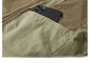 Detail view of inner pocket with mesh lining on quick-dry fishing vest for men