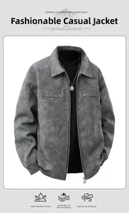 Detail of grey suede jacket with metallic studs on pockets and a waterproof finish