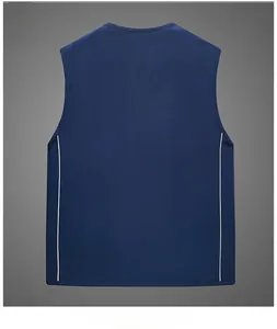 Detail view of navy mesh fishing vest featuring white contrast side stripes and breathable fabric