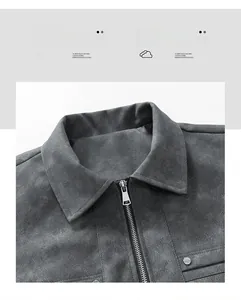 Detail of gray suede jacket showing collar, metal zipper, and premium fabric texture