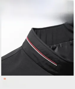 Detail shot of men's casual black jacket showing stand collar with red and white stripes