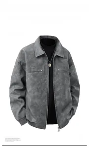 Detail view of the light grey faux suede jacket featuring metal zipper and ribbed cuffs