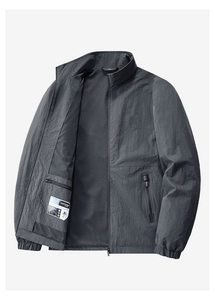 Detail view of deep grey jacket with breathable mesh lining and secure interior zip pocket