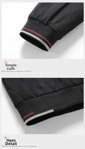 Detailed view of elastic ribbed cuffs and hem with red and white contrast stripes