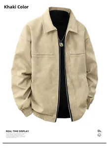 Detail view of khaki suede jacket featuring ribbed hem and metal stud accents