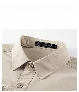Detailed view of khaki outdoor shirt collar with durable fabric texture and label