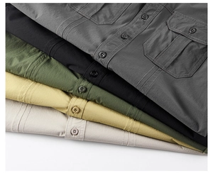 Detail view of five tactical ripstop shirts in grey black green khaki and off-white colors