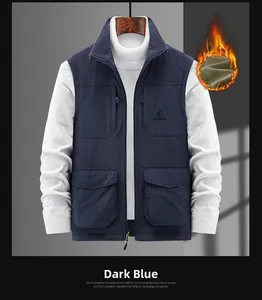 Detail view of navy blue fleece vest with four practical pockets and high neck stand collar