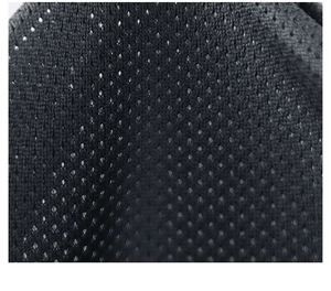 Close-up of black breathable diamond mesh fabric on sports jacket lining for air flow