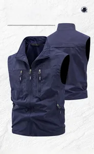 Detail of navy blue utility vest showing zipper pockets and breathable mesh lining