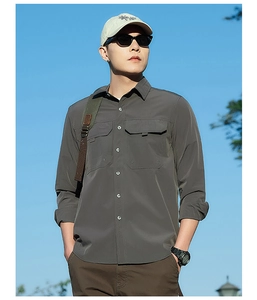 Macro shot of outdoor cargo shirt showing double pocket details and durable stitching