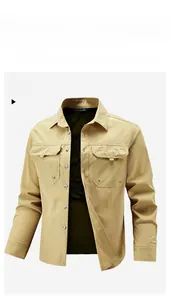 Detailed close-up of khaki utility shirt fabric with flap pockets and reinforced stitching