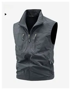 Detail view of dark grey fishing vest featuring multi-pocket utility design and zipper