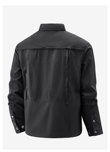 Detail view of black workwear shirt back with breathable textured fabric and vent pleats