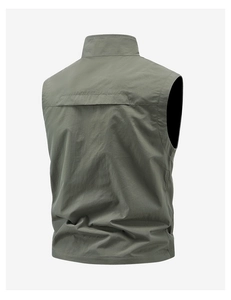 Detail view of olive green lightweight outdoor vest with stand collar and textured fabric