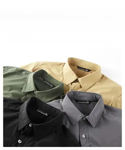 Detail view of four casual men's shirts stacking showing collar and wrinkle-free fabric
