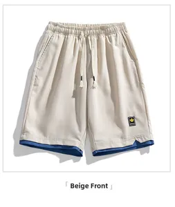 Macro detail of men's quick-dry shorts in beige with blue faux layered hem and drawstring