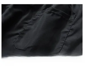 Macro shot of back pocket stitching and breathable quick-dry fabric on men's summer shorts