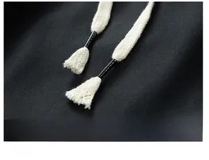 Detail of men's quick-dry shorts featuring white braided drawstring with plastic tips