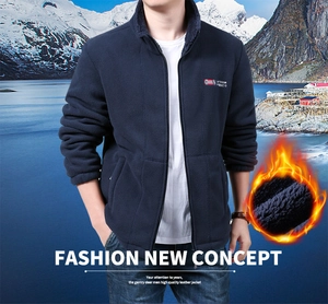 Detail of warm thermal fleece lining and outdoor embroidery on navy zip-up jacket
