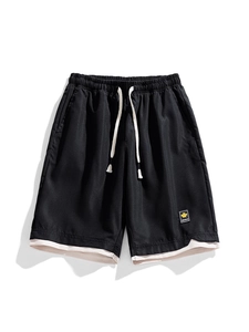 Men's quick-dry sports shorts with layered hem design and maple leaf patch detail