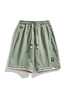 Men's casual quick-dry shorts in sage green with elastic drawstring waist and maple leaf patch