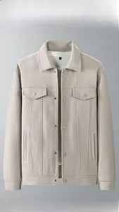 Close-up of oatmeal wool jacket with lapel collar and snap button chest pockets