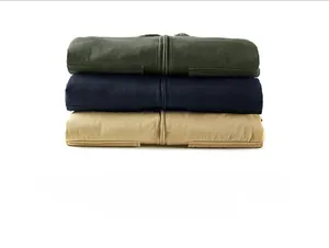 Detailed stack of khaki navy and olive green padded jackets with heavy twill fabric and zippers