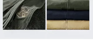 Detail of shield embroidery on heavy cotton jacket with three color options shown