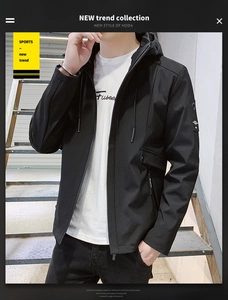 Detail shot of black hooded men's jacket with sleeve utility pocket and drawstring hood