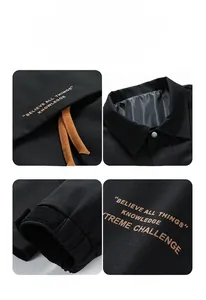 Detail view of black men's jacket showing turn-down collar and velcro windproof cuffs