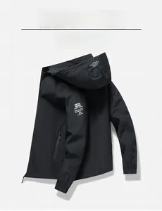 Detail of waterproof windbreaker featuring adjustable drawstring hood and logo print sleeve