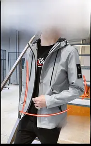 Detail view of light grey slim-fit hooded jacket featuring windproof fabric and drawstring