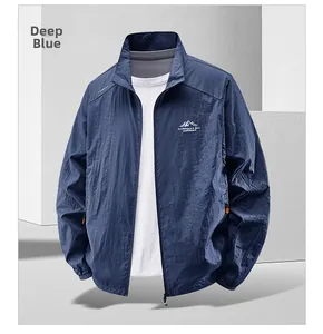 Detail of dark blue sun protection jacket with outdoor logo and breathable texture