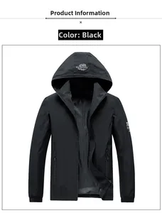 Detail of black waterproof outdoor jacket showing detachable hood and zipper pockets