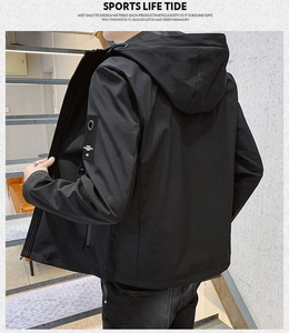 Detail view of men's slim fit hooded jacket with stylish sleeve patch and urban design