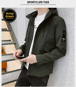 Detail of army green hooded jacket featuring a black decorative sleeve patch and durable fabric