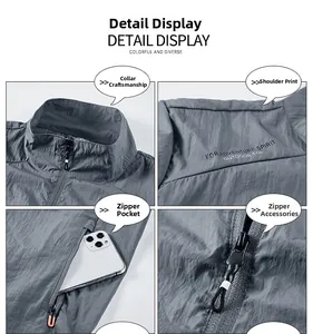 Detail view of gray sun protection jacket with zip pockets and breathable fabric texture