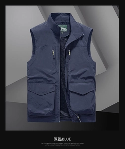 Detail of dark blue outdoor vest featuring functional pockets and breathable mesh lining