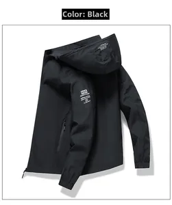 Detail view of black waterproof jacket with detachable hood and zipper pockets