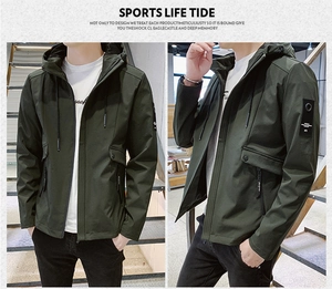 Detail view of dark green hooded jacket featuring cargo pockets and stylish arm patch detail