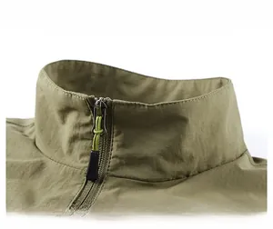Detail showing the stand collar and metal zipper on this olive green outdoor vest