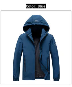 Detail shot of navy blue hooded jacket featuring waterproof fabric and side zipper pockets