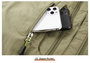 Detail of army green fishing vest featuring a zippered pocket with large storage capacity