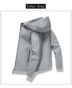 Detail view of light grey windbreaker jacket sleeve with elastic cuff and zipper pocket