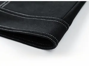 Detailed close-up of jacket hem featuring premium suede texture and white contrast stitching