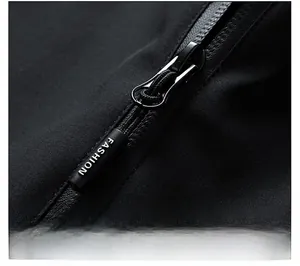 Macro detail of waterproof zipper and fashion logo on the black outdoor jacket