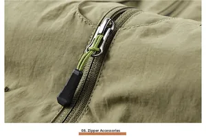 Detail of durable silver zipper with non-slip puller on olive green outdoor vest fabric