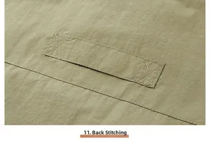 Detail view of durable back stitching on a functional outdoor multi-pocket vest