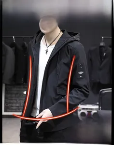 Close-up of a men's slim fit black hooded jacket with zipper pockets and arm patch